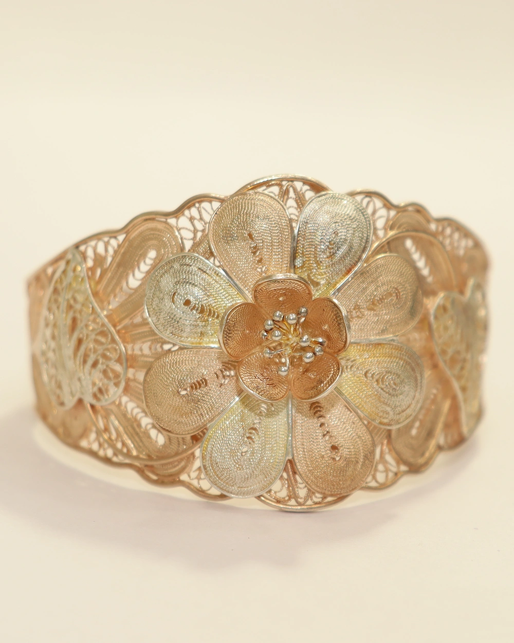 Intricate gold filigree flower design on 925 silver cuff bracelet
