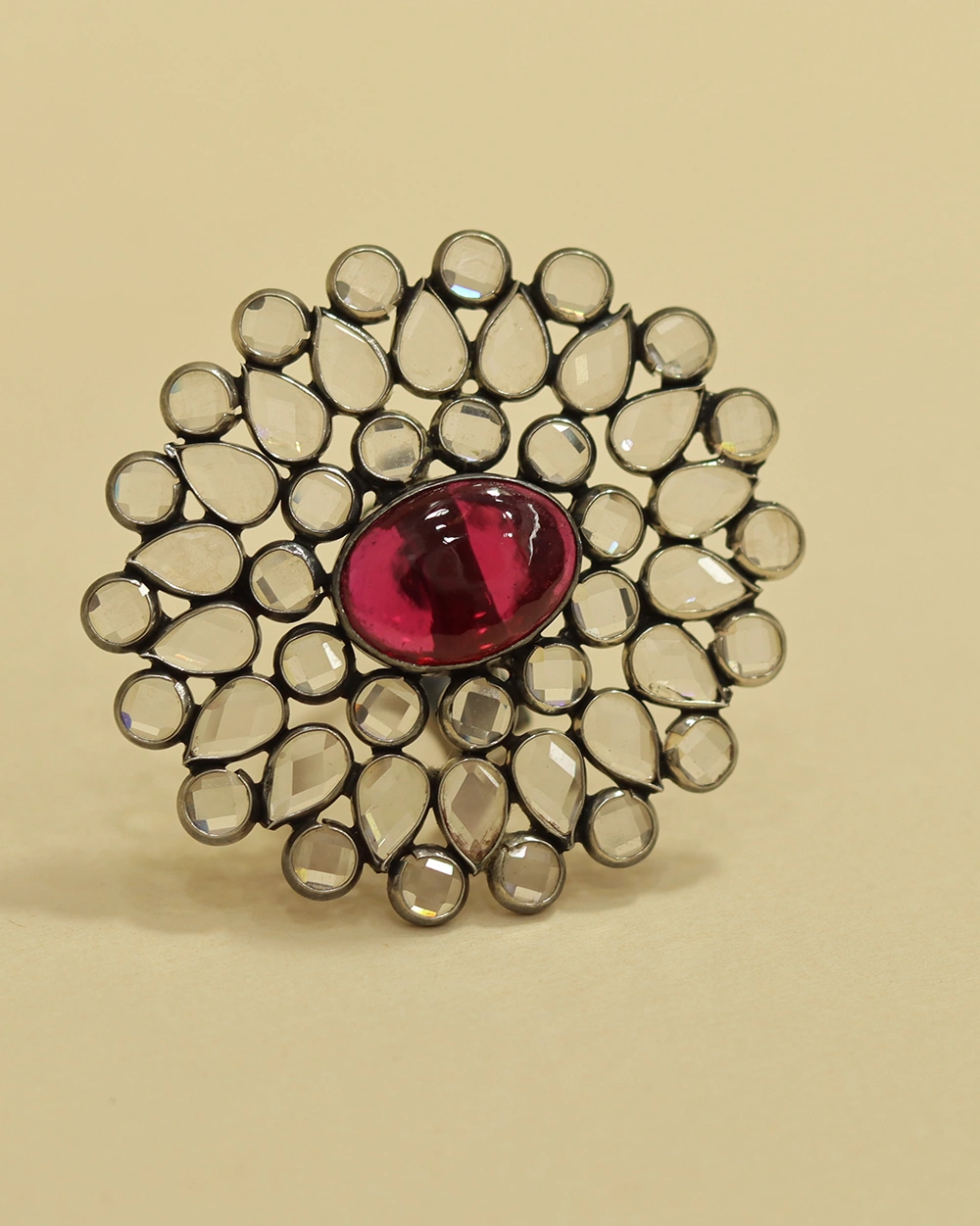 Woman wearing handcrafted silver floral ruby cocktail ring