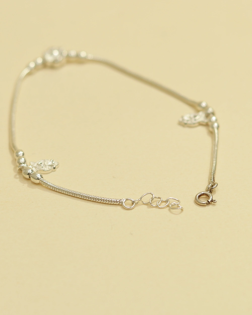 Elegant Silver Bracelet with Delicate Charms